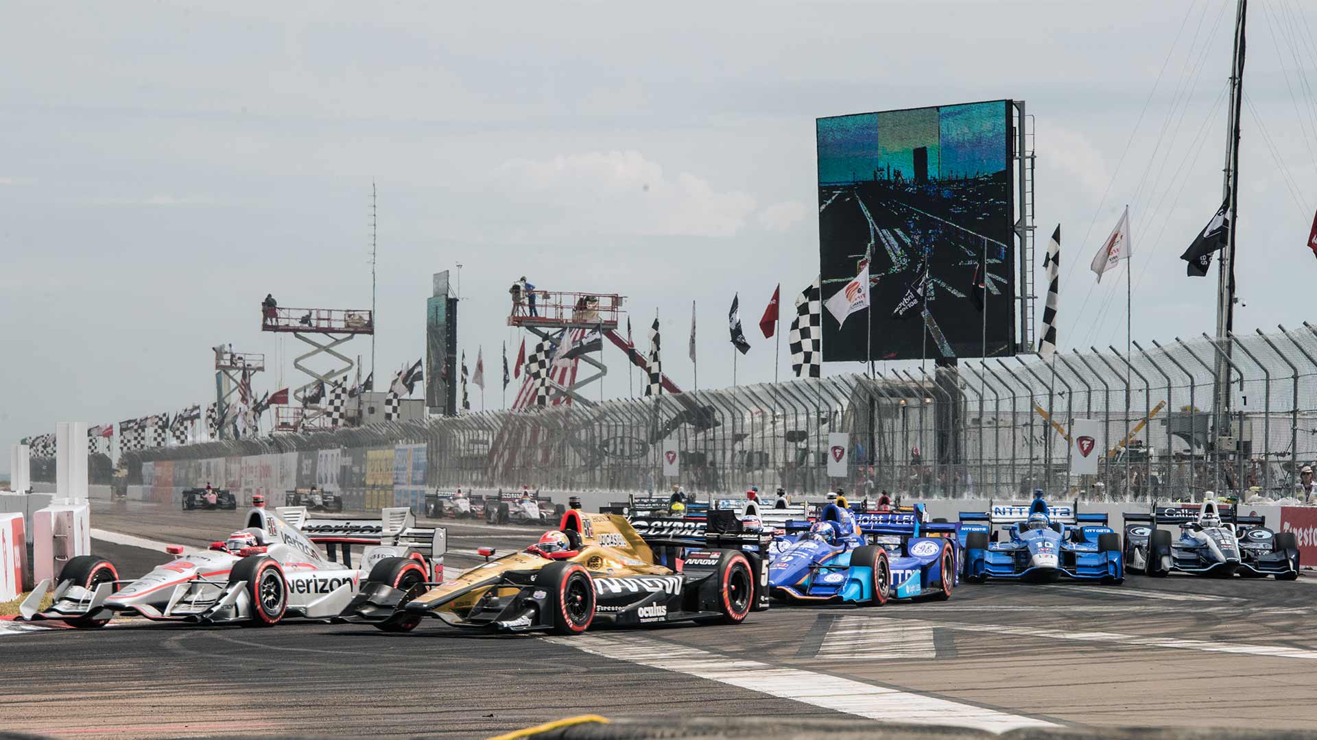 IndyCars speeding into turn 1 at the Firestone Grand Prix of St. Petersburg